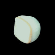 Pistachio Calcite tumbled stone 20-31mm 12-18g in sunlight - Rocks and Things Store