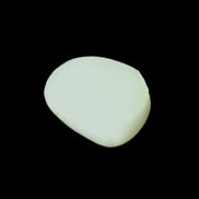 Pistachio Calcite tumbled stone 20-31mm 12-18g in sunlight - Rocks and Things Store