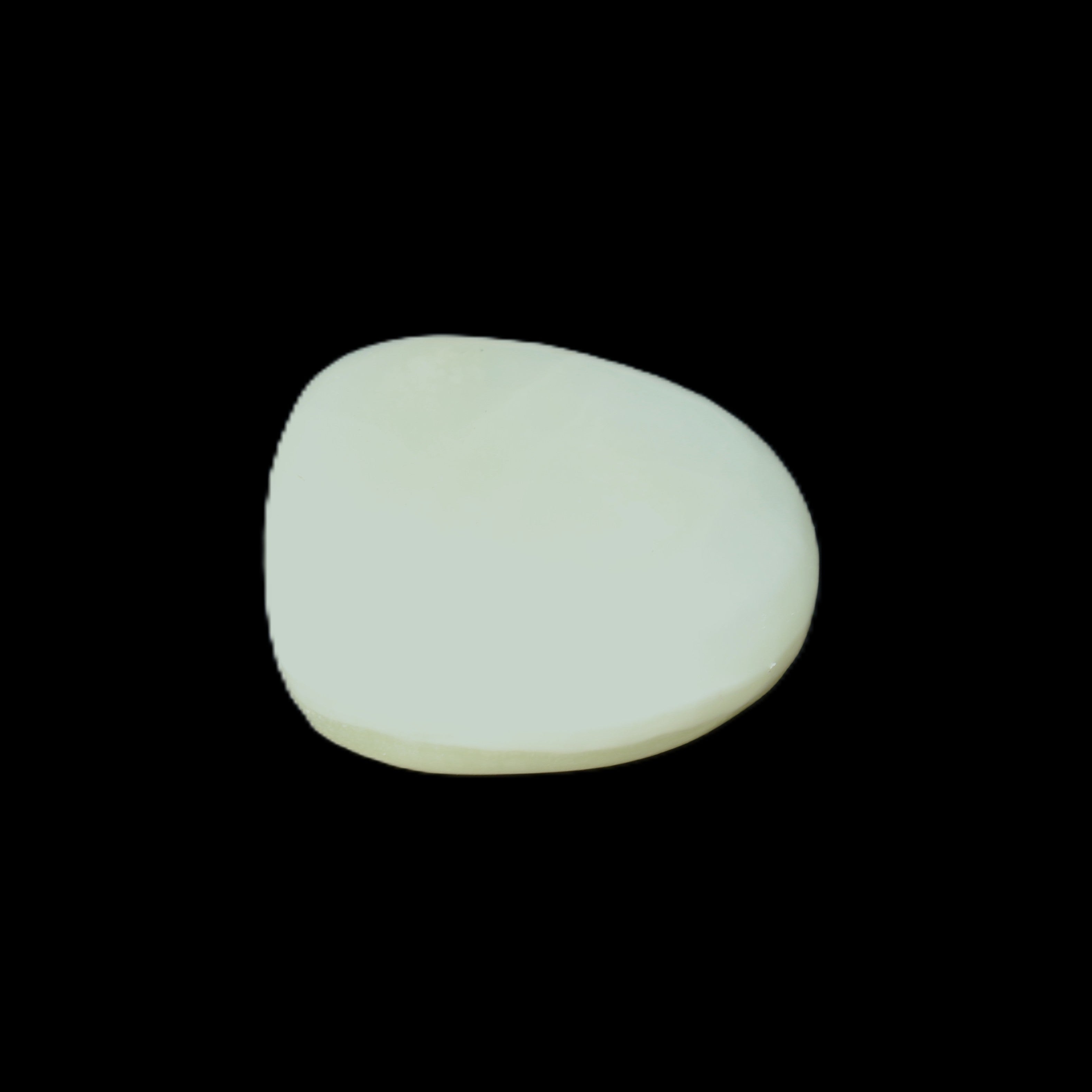 Pistachio Calcite tumbled stone 20-31mm 12-18g in sunlight - Rocks and Things Store