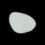 Pistachio Calcite tumbled stone 20-31mm 12-18g in sunlight - Rocks and Things Store