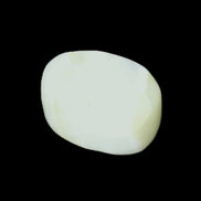 Pistachio Calcite tumbled stone 20-31mm 12-18g in sunlight - Rocks and Things Store