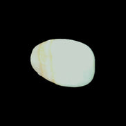 Pistachio Calcite tumbled stone 20-31mm 12-18g in sunlight - Rocks and Things Store