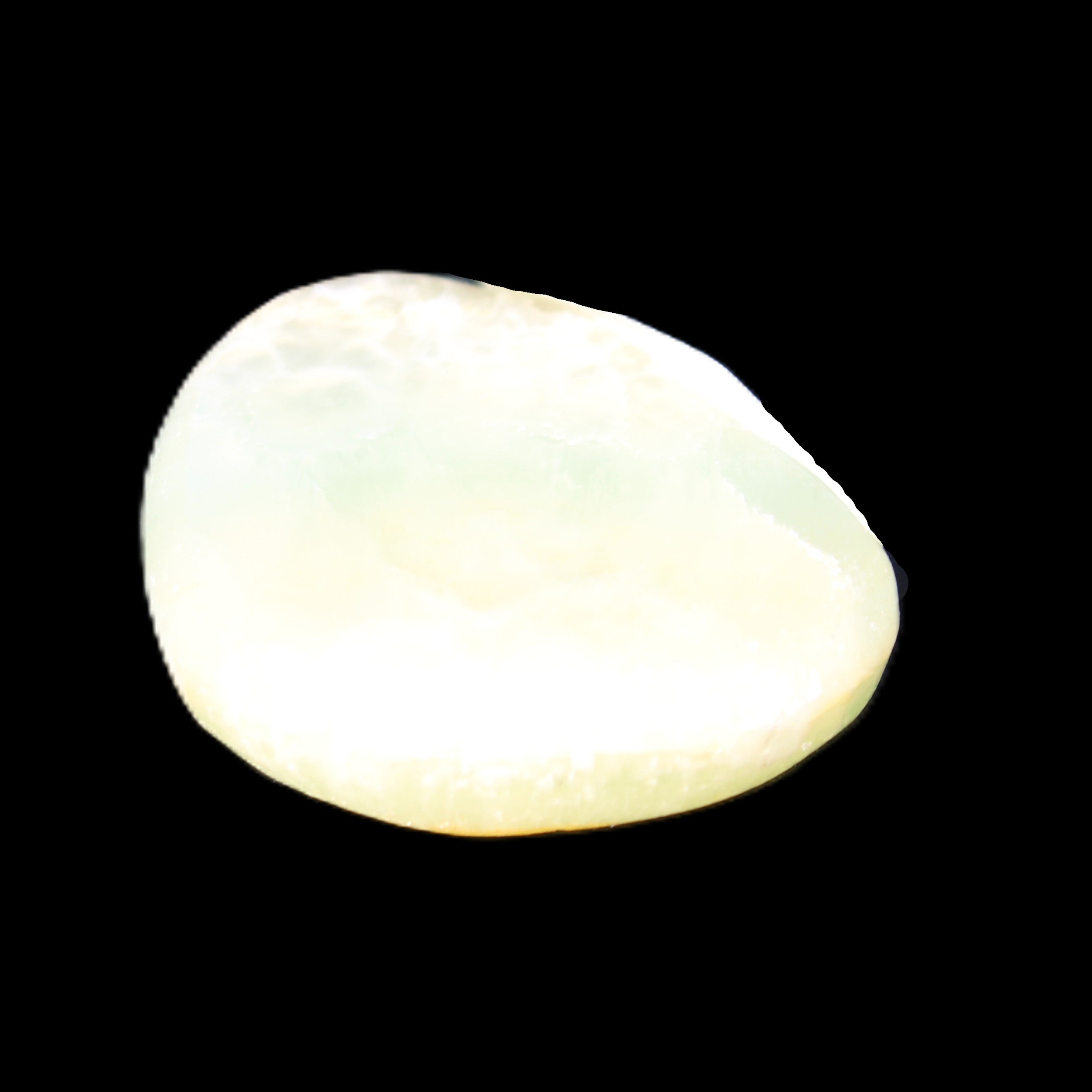 Pistachio Calcite tumbled stone 20-31mm 12-18g in sunlight - Rocks and Things Store