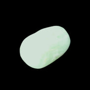 Pistachio Calcite tumbled stone 20-31mm 12-18g in sunlight - Rocks and Things Store