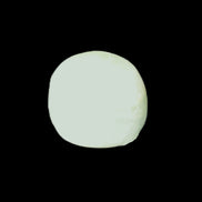 Pistachio Calcite tumbled stone 20-31mm 12-18g in sunlight - Rocks and Things Store