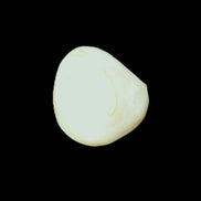 Pistachio Calcite tumbled stone 20-31mm 12-18g in sunlight - Rocks and Things Store