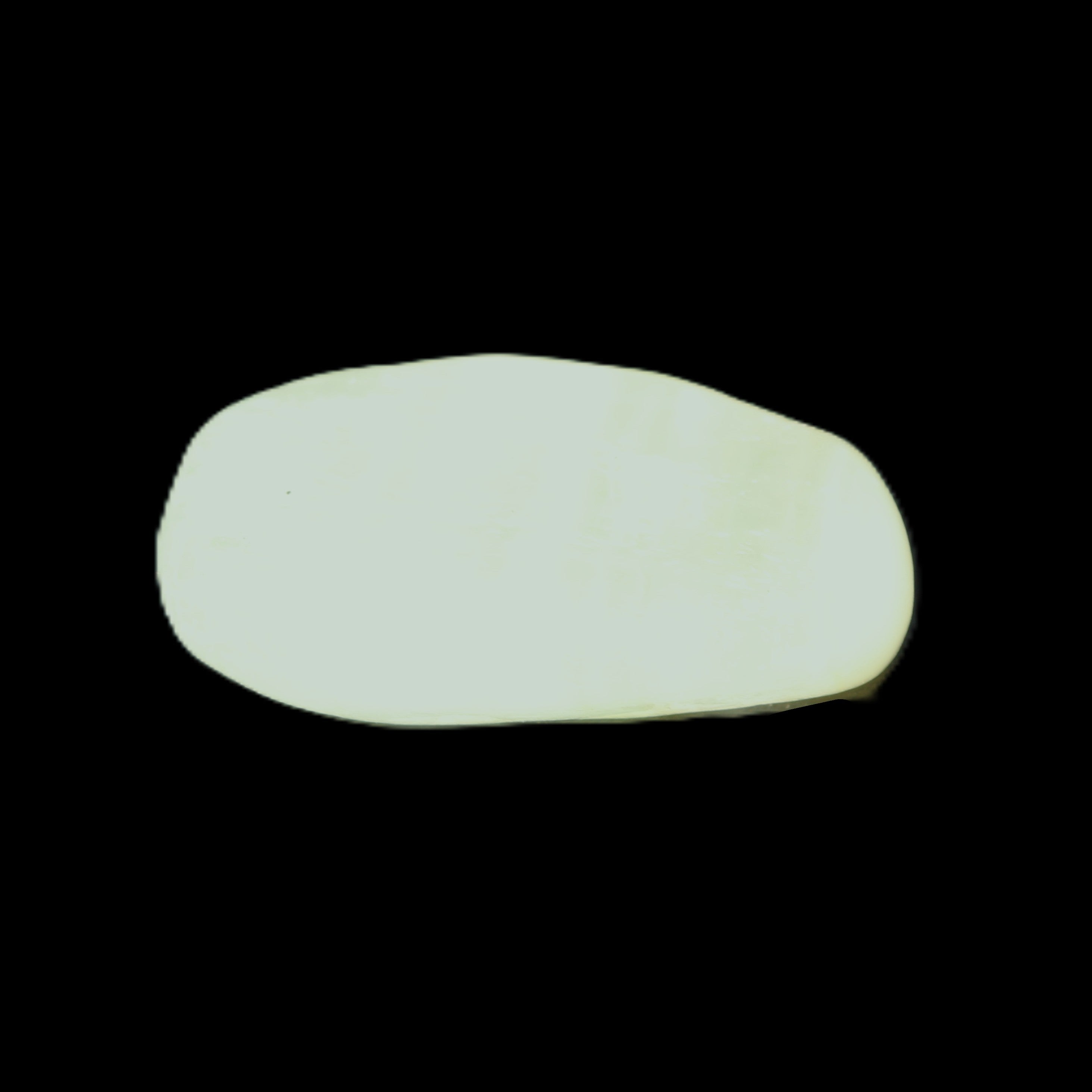 Pistachio Calcite tumbled stone 20-31mm 12-18g in sunlight - Rocks and Things Store