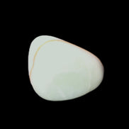 Pistachio Calcite tumbled stone 20-31mm 12-18g in sunlight - Rocks and Things Store