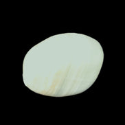 Pistachio Calcite tumbled stone 20-31mm 12-18g in sunlight - Rocks and Things Store