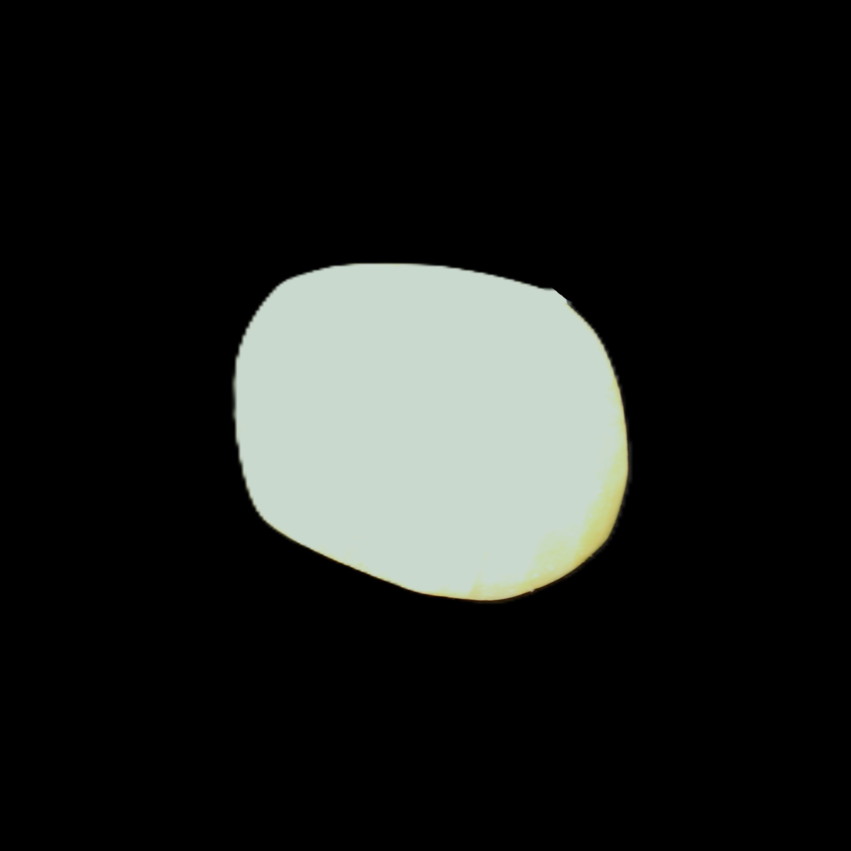 Pistachio Calcite tumbled stone 20-31mm 12-18g in sunlight - Rocks and Things Store