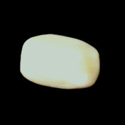 Pistachio Calcite tumbled stone 20-31mm 12-18g in sunlight - Rocks and Things Store