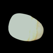 Pistachio Calcite tumbled stone 20-31mm 12-18g in sunlight - Rocks and Things Store