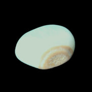 Caribbean Calcite tumbled stone 27*20*13mm 13g in sunlight - Rocks and Things Store