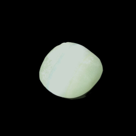 Pistachio Calcite tumbled stone 23-33mm 14-20g in sunlight - Rocks and Things Store