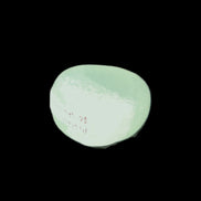Pistachio Calcite tumbled stone 23-33mm 14-20g in sunlight - Rocks and Things Store