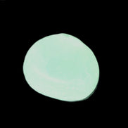 Pistachio Calcite tumbled stone 23-33mm 14-20g in sunlight - Rocks and Things Store