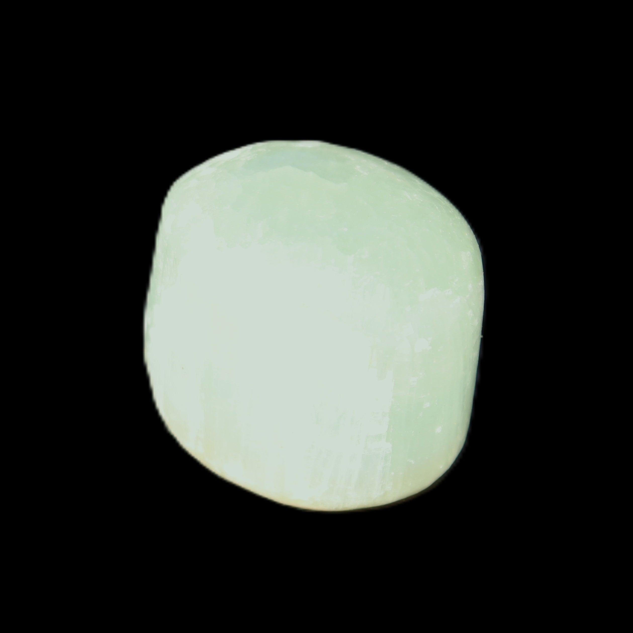 Pistachio Calcite tumbled stone 23-33mm 14-20g in sunlight - Rocks and Things Store