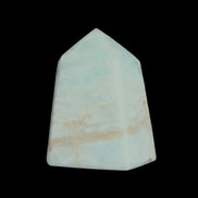 Pistachio Calcite obelisk 51*35*24mm 77g in sunlight - Rocks and Things Store