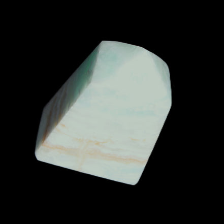Pistachio Calcite obelisk 51*35*24mm 77g in sunlight - Rocks and Things Store