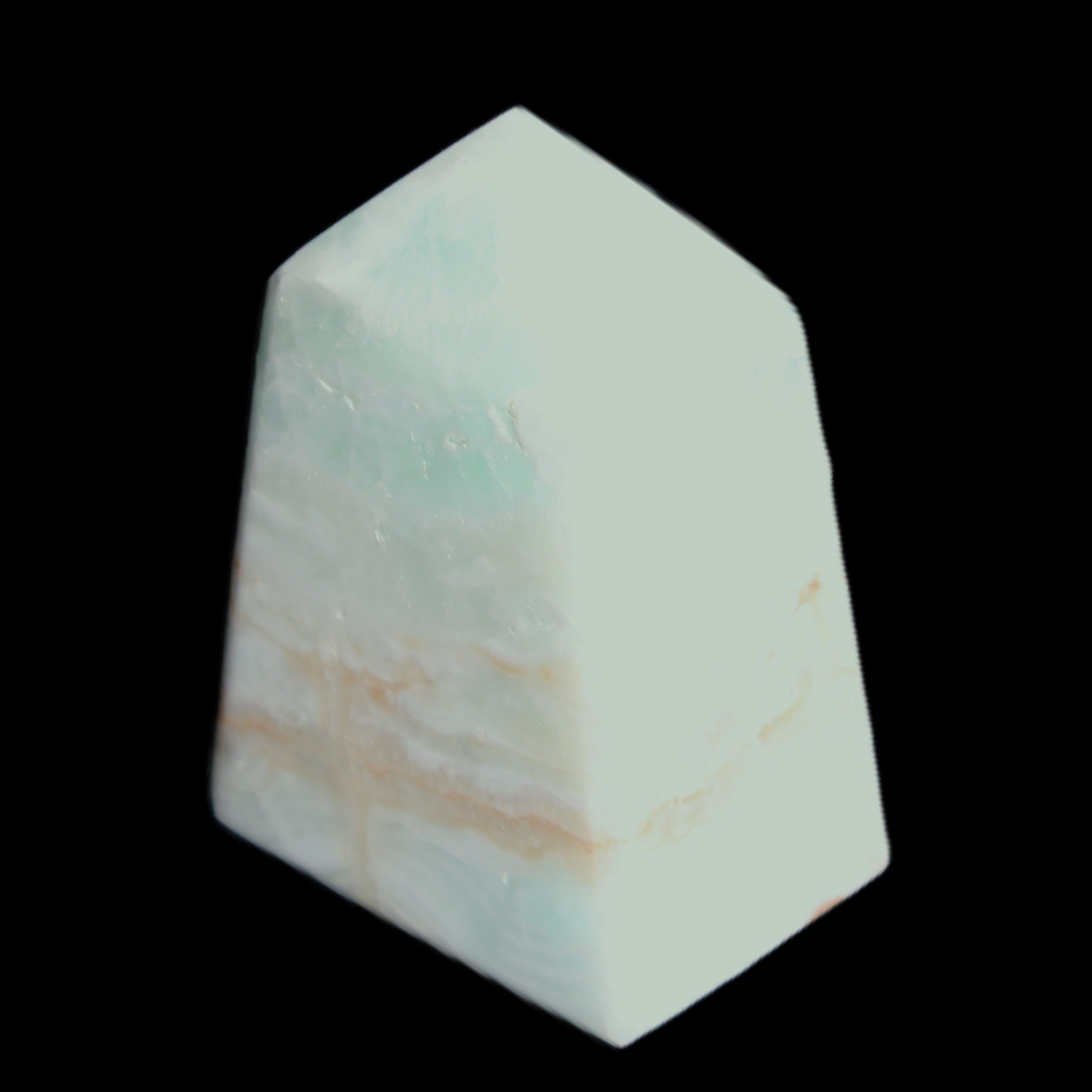 Pistachio Calcite obelisk 51*35*24mm 77g in sunlight - Rocks and Things Store