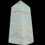 Pistachio Calcite obelisk 75*35*28mm 142g in sunlight - Rocks and Things Store