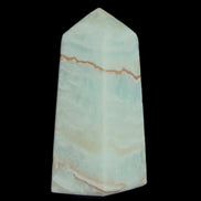Pistachio Calcite obelisk 75*35*28mm 142g in sunlight - Rocks and Things Store