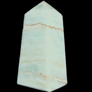 Pistachio Calcite obelisk 75*35*28mm 142g in sunlight - Rocks and Things Store