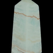 Pistachio Calcite obelisk 75*35*28mm 142g in sunlight - Rocks and Things Store