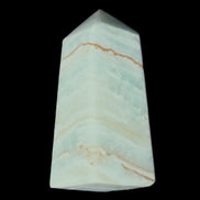 Pistachio Calcite obelisk 75*35*28mm 142g in sunlight - Rocks and Things Store
