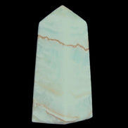 Pistachio Calcite obelisk 75*35*28mm 142g in sunlight - Rocks and Things Store