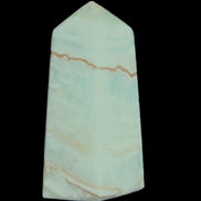 Pistachio Calcite obelisk 75*35*28mm 142g in sunlight - Rocks and Things Store