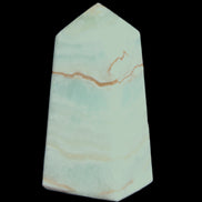 Pistachio Calcite obelisk 75*35*28mm 142g in sunlight - Rocks and Things Store