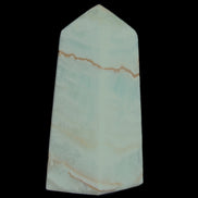 Pistachio Calcite obelisk 75*35*28mm 142g in sunlight - Rocks and Things Store