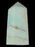 Pistachio Calcite obelisk 68*28*24mm 92g in sunlight - Rocks and Things Store