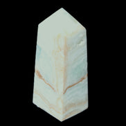 Pistachio Calcite obelisk 68*28*24mm 92g in sunlight - Rocks and Things Store