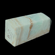 Pistachio Calcite obelisk 68*28*24mm 92g in sunlight - Rocks and Things Store