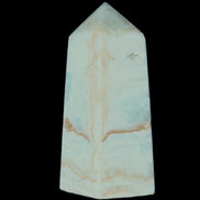 Pistachio Calcite obelisk 68*28*24mm 92g in sunlight - Rocks and Things Store
