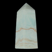 Pistachio Calcite obelisk 68*28*24mm 92g in sunlight - Rocks and Things Store