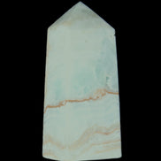 Pistachio Calcite obelisk 68*28*24mm 92g in sunlight - Rocks and Things Store