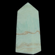 Pistachio Calcite obelisk 68*28*24mm 92g in sunlight - Rocks and Things Store