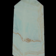 Pistachio Calcite obelisk 68*28*24mm 92g in sunlight - Rocks and Things Store