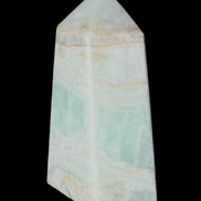 Pistachio Calcite obelisk 72*35*24mm 110g in sunlight - Rocks and Things Store