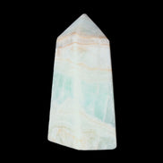 Pistachio Calcite obelisk 72*35*24mm 110g in sunlight - Rocks and Things Store