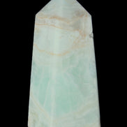 Pistachio Calcite obelisk 72*35*24mm 110g in sunlight - Rocks and Things Store