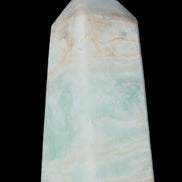 Pistachio Calcite obelisk 72*35*24mm 110g in sunlight - Rocks and Things Store