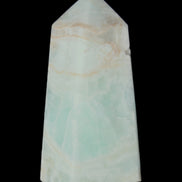 Pistachio Calcite obelisk 72*35*24mm 110g in sunlight - Rocks and Things Store