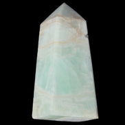 Pistachio Calcite obelisk 72*35*24mm 110g in sunlight - Rocks and Things Store