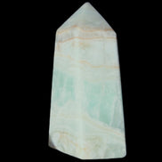 Pistachio Calcite obelisk 72*35*24mm 110g in sunlight - Rocks and Things Store