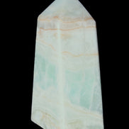 Pistachio Calcite obelisk 72*35*24mm 110g in sunlight - Rocks and Things Store