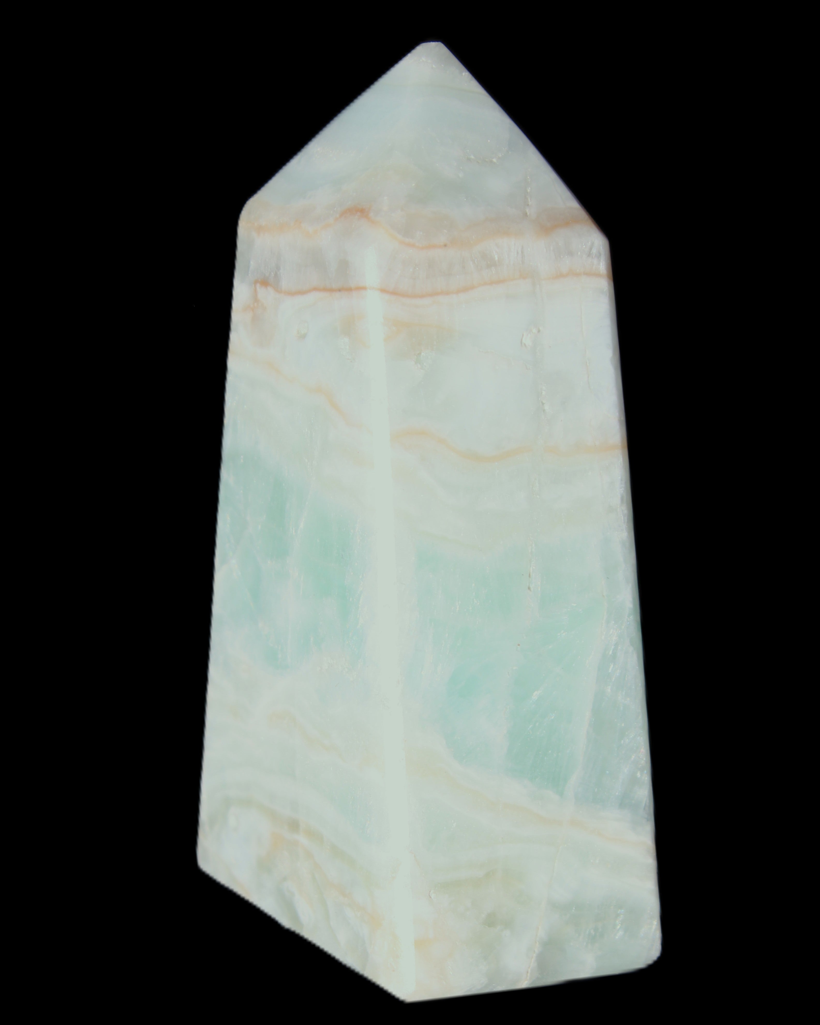 Pistachio Calcite obelisk 72*35*24mm 110g in sunlight - Rocks and Things Store